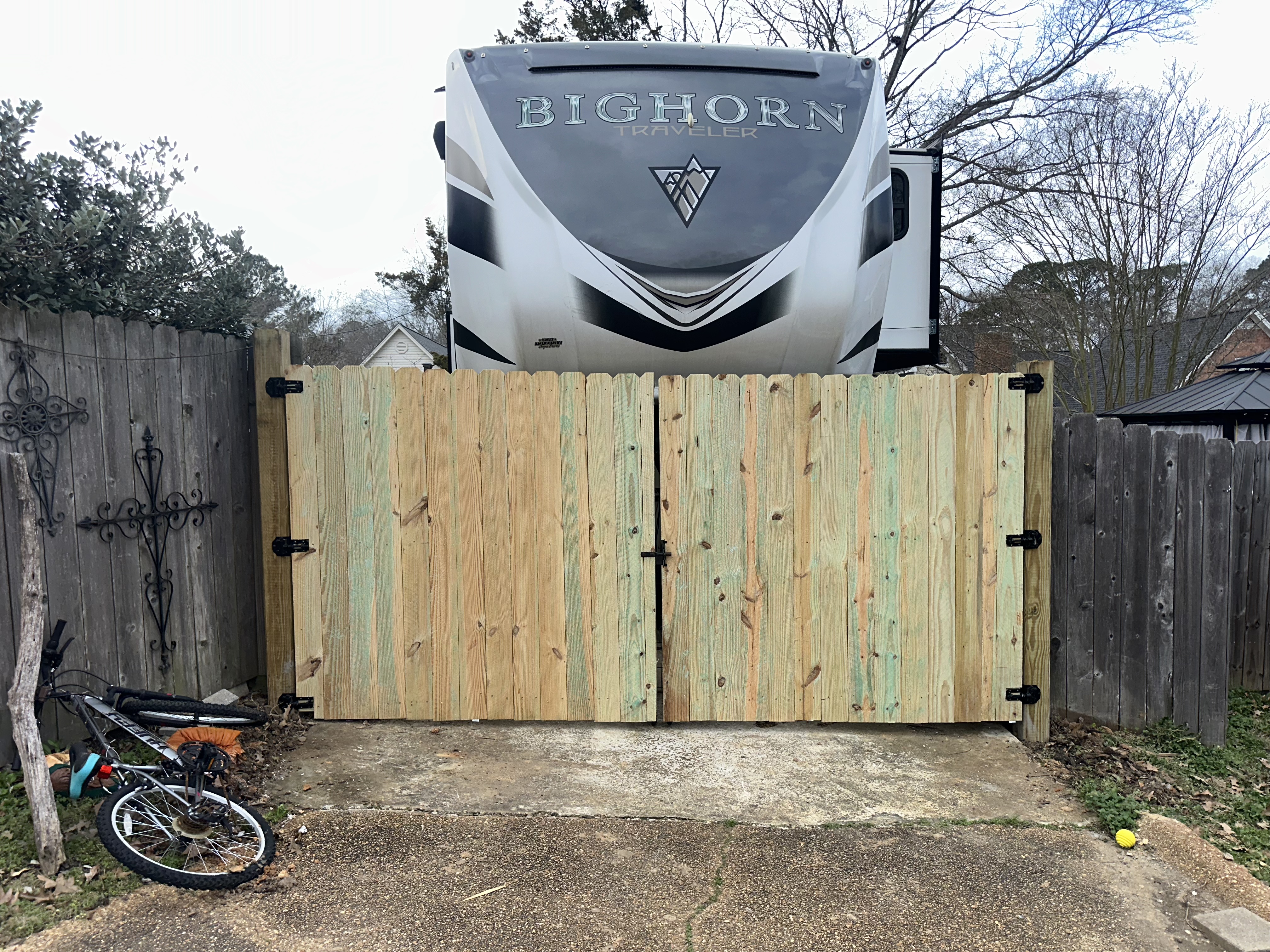 New pressure-treated fence and gate after BP Lawn and Home repair